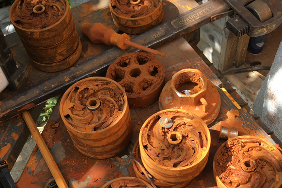 Dismantled borehole pump showing effects of advanced iron fouling